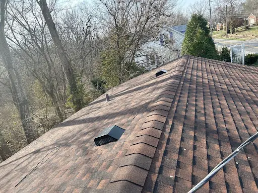 Brown shingle roof with newly installed box vents on a residential home in Louisville, KY