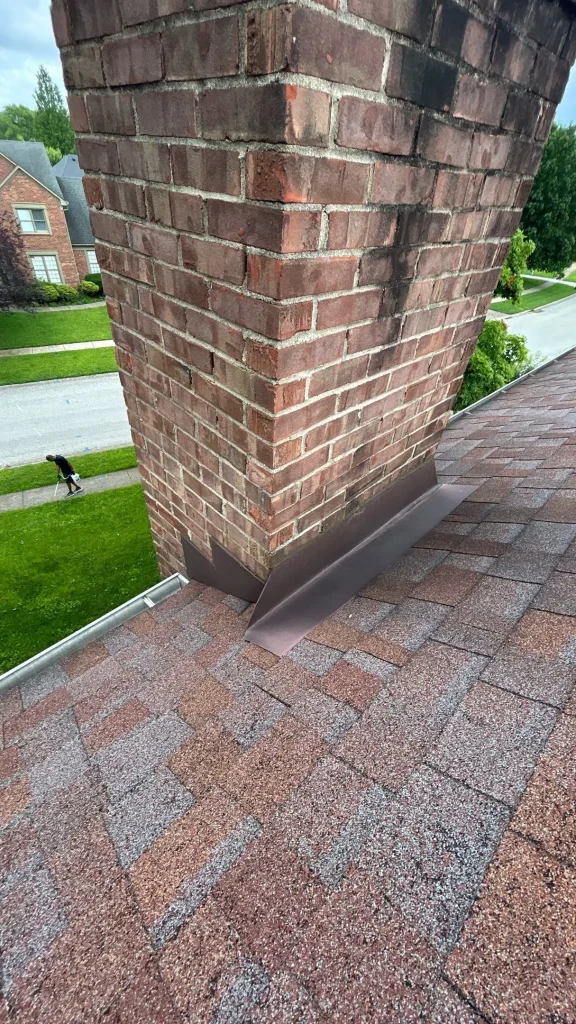 Chimney with new flashing installation on a Louisville home roof