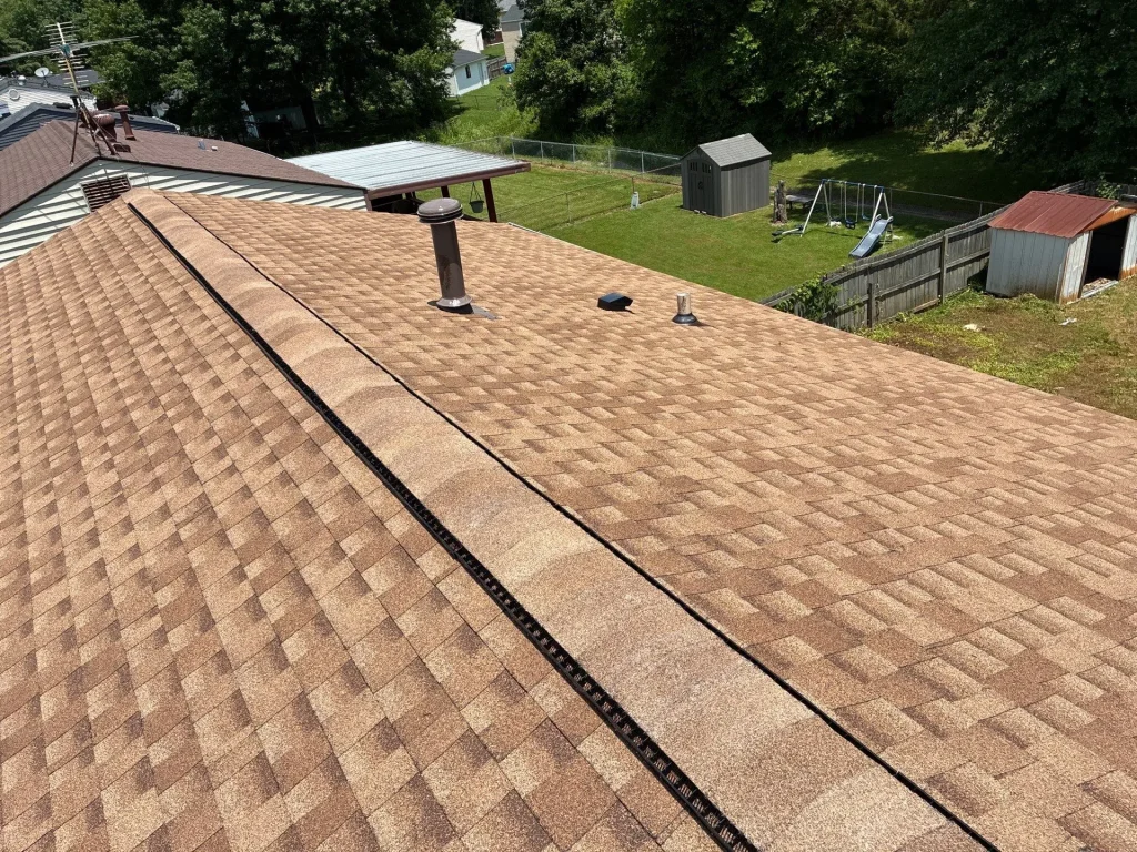 Newly repaired roof with vent penetrations on a Louisville home