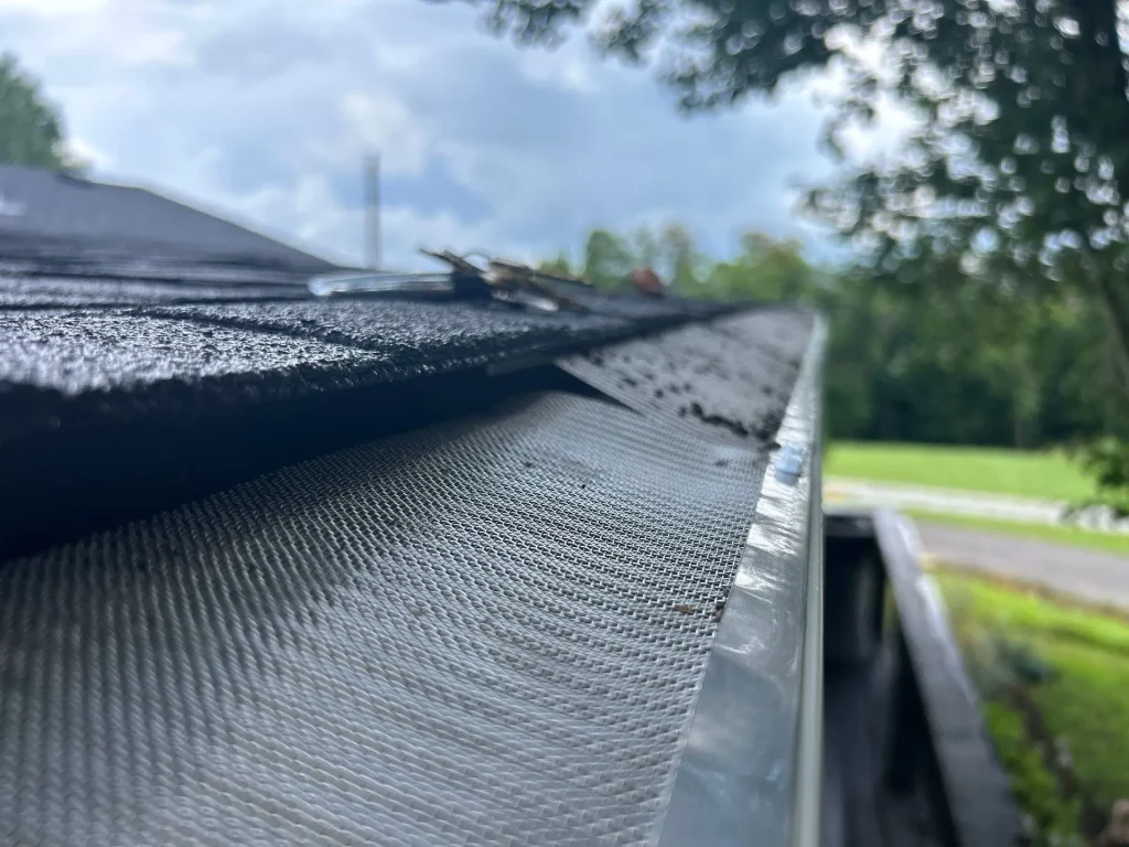 Close-up of newly installed gutter guard on a Richmond, KY home by AIC Roofing & Construction