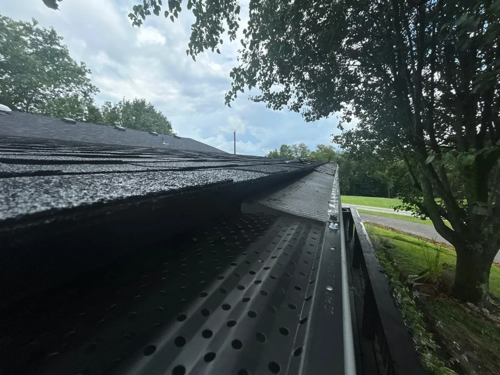 Close-up of newly installed gutter guard system on a Richmond, KY home by AIC Roofing & Construction