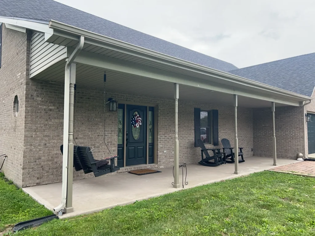 New seamless gutters installed on a brick home in Richmond, KY by AIC Roofing & Construction