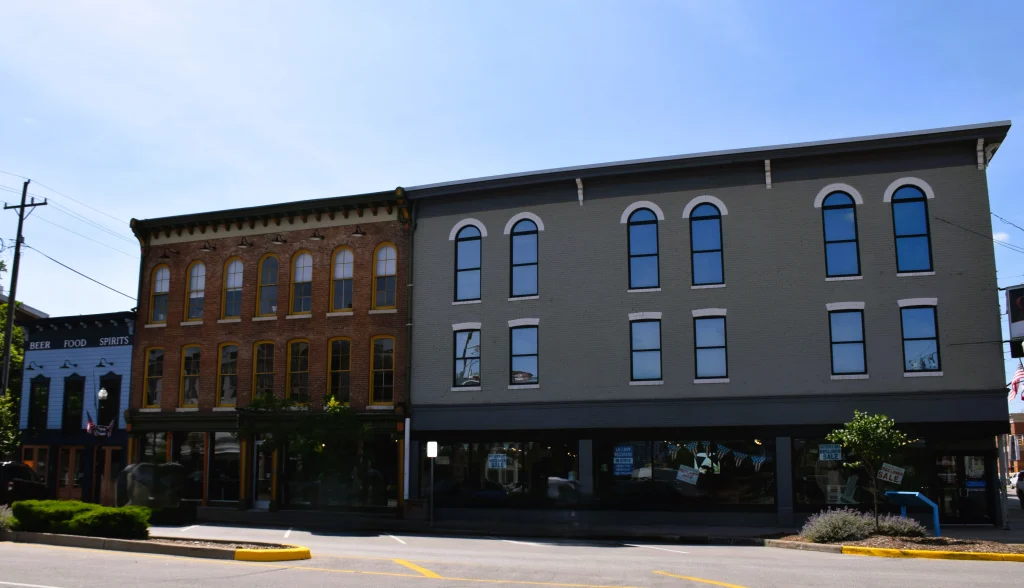 Row of historic buildings and storefronts on Market Street in New Albany, Indiana