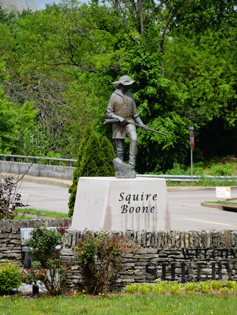Statue of Squire Boone on a stone pedestal in Shelbyville, KY