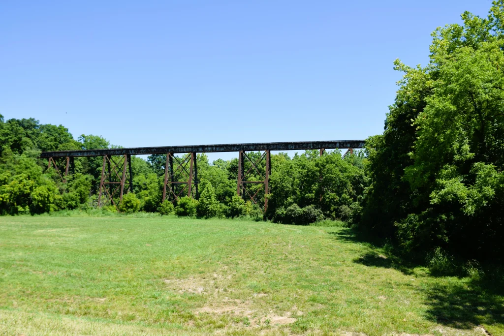 Elevated railroad bridge surrounded by trees in Fisherville, Kentucky