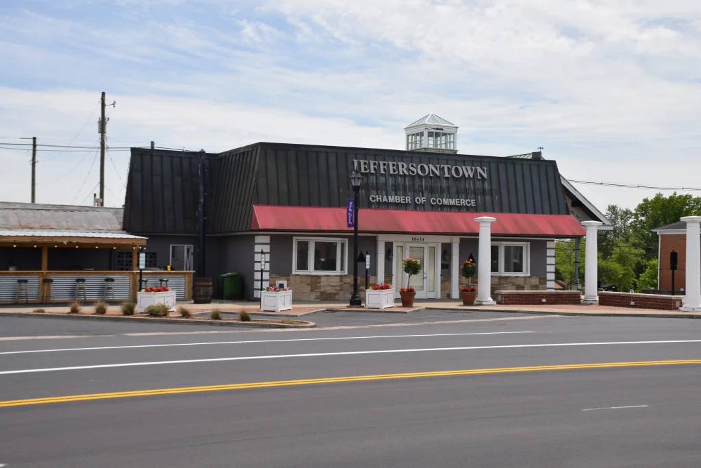 Jeffersontown Chamber of Commerce building with red awning and black metal roof