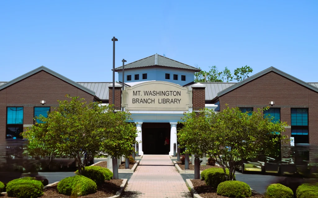Front entrance of Mt. Washington library with trees and walkway
