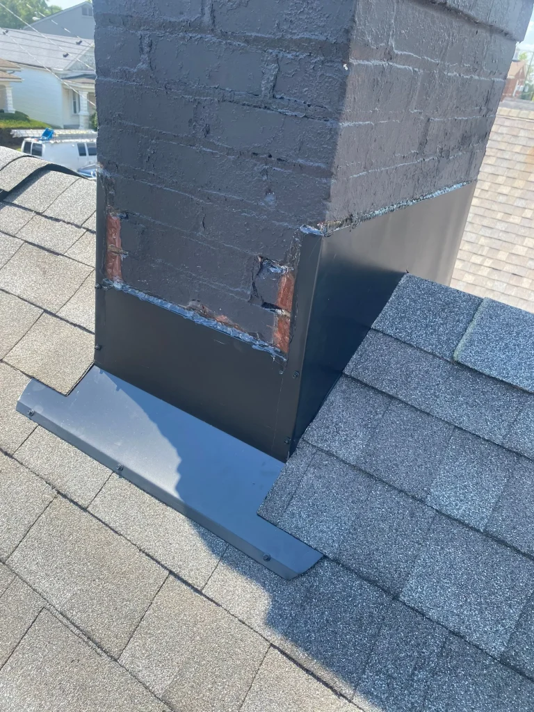 Freshly installed chimney flashing on a Louisville roof