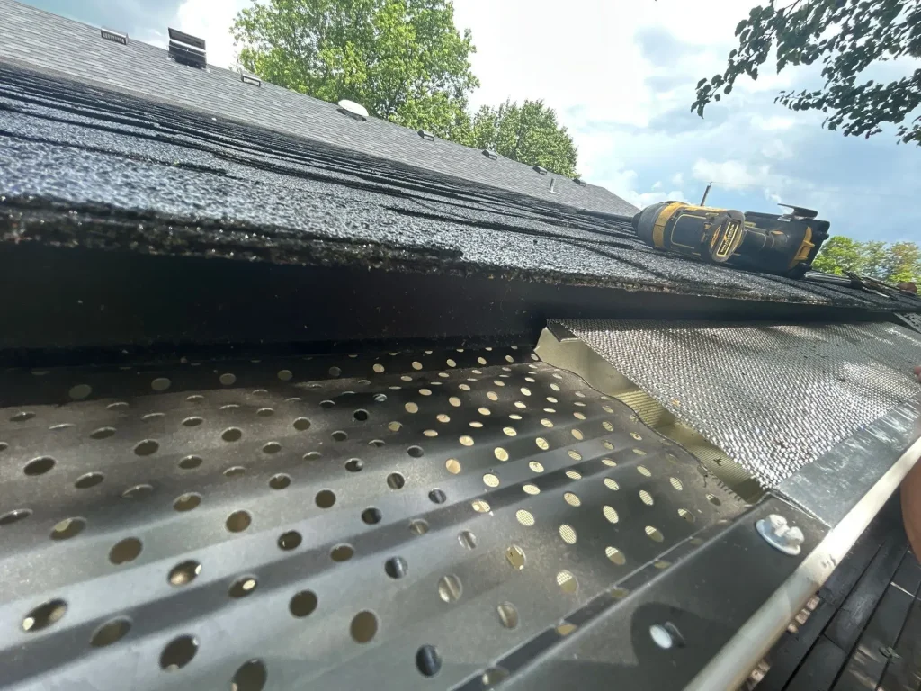 Close-up of newly installed perforated metal gutter guard on a Richmond, KY home by AIC Roofing & Construction