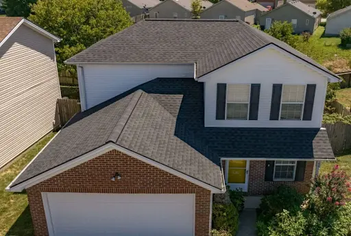 Two-story Richmond, KY home with new black asphalt shingle roof installed by AIC Roofing