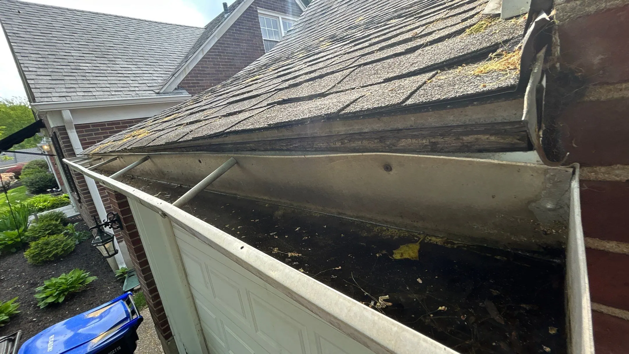 Old Gutter with Water Damage on Louisville Home Clogged and damaged gutter with rotting fascia board on a Louisville home