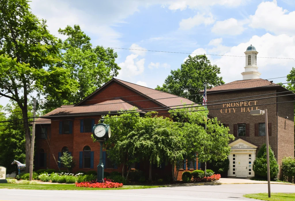 Brick building with a cupola labeled "Prospect City Hall" in Prospect, Kentucky
