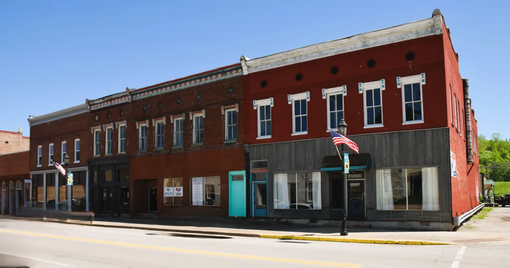Historic Taylorsville commercial buildings with red brick facades and flat roofs maintained by Taylorsville roofing contractors