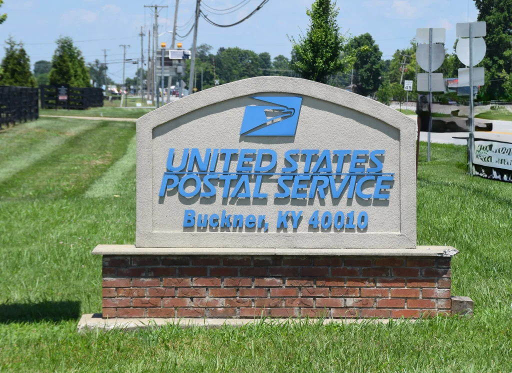 USPS Buckner KY postal office sign on a sunny day