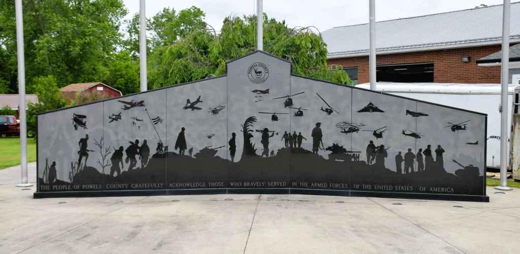 Powell County veterans memorial wall with silhouettes of military service members