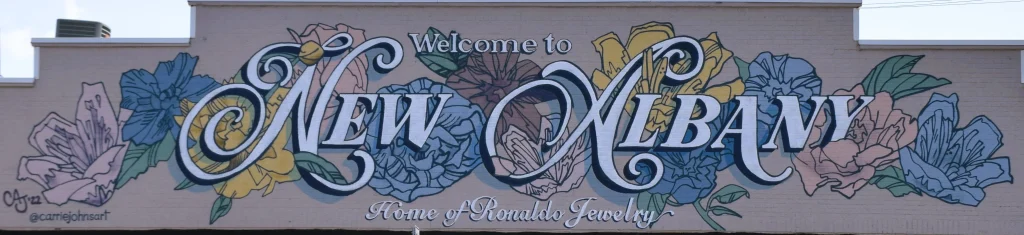 Floral mural with text saying Welcome to New Albany Home of Ronaldo Jewelry