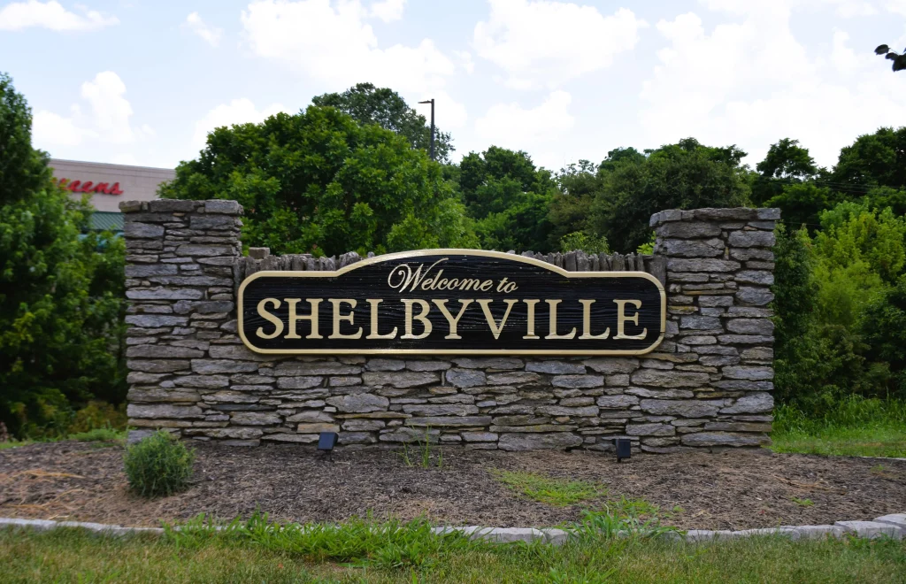 Welcome to Shelbyville sign set in stone landscaping