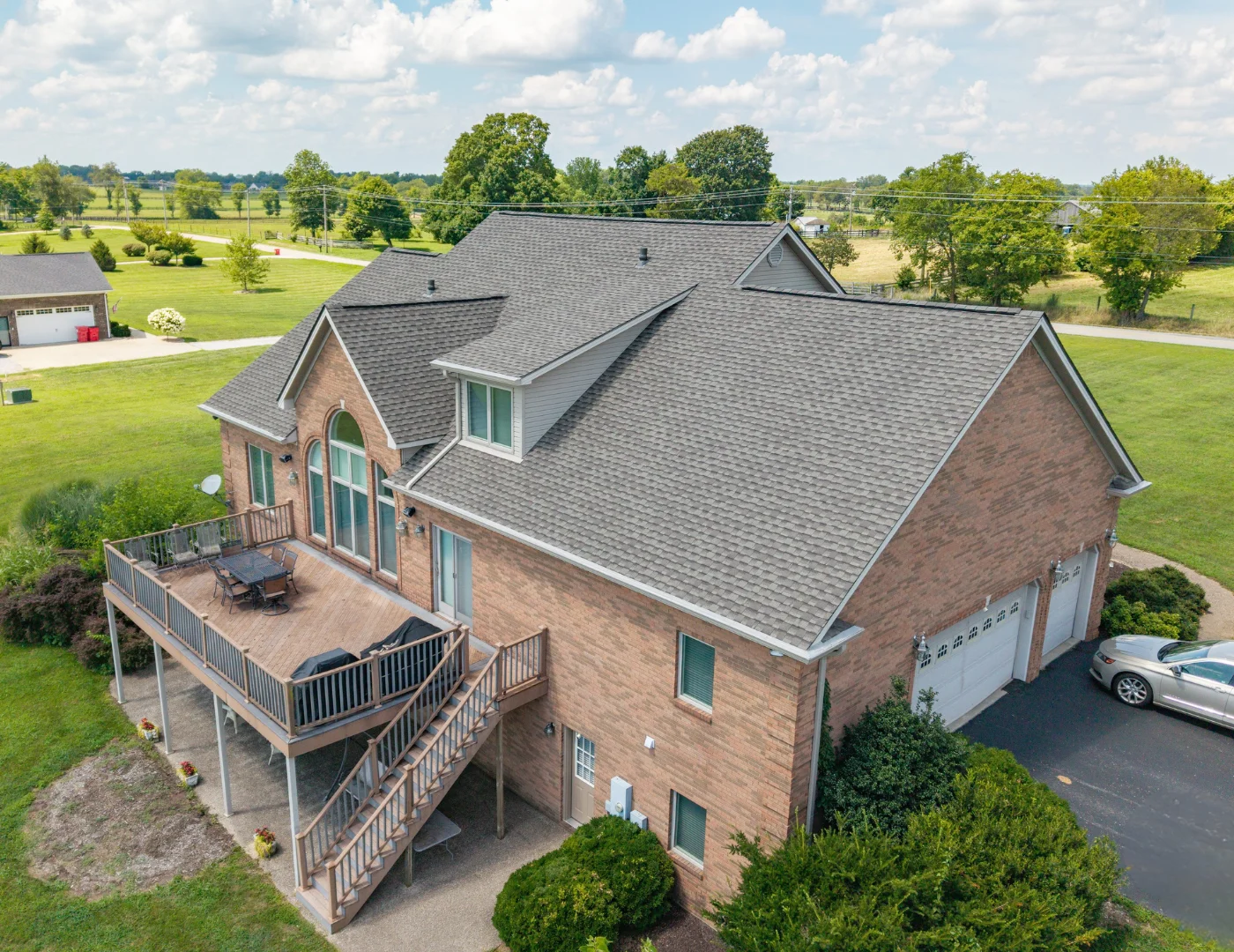 AIC Roofing & Construction completed a GAF UHDZ shingle roof replacement on a rural brick home.