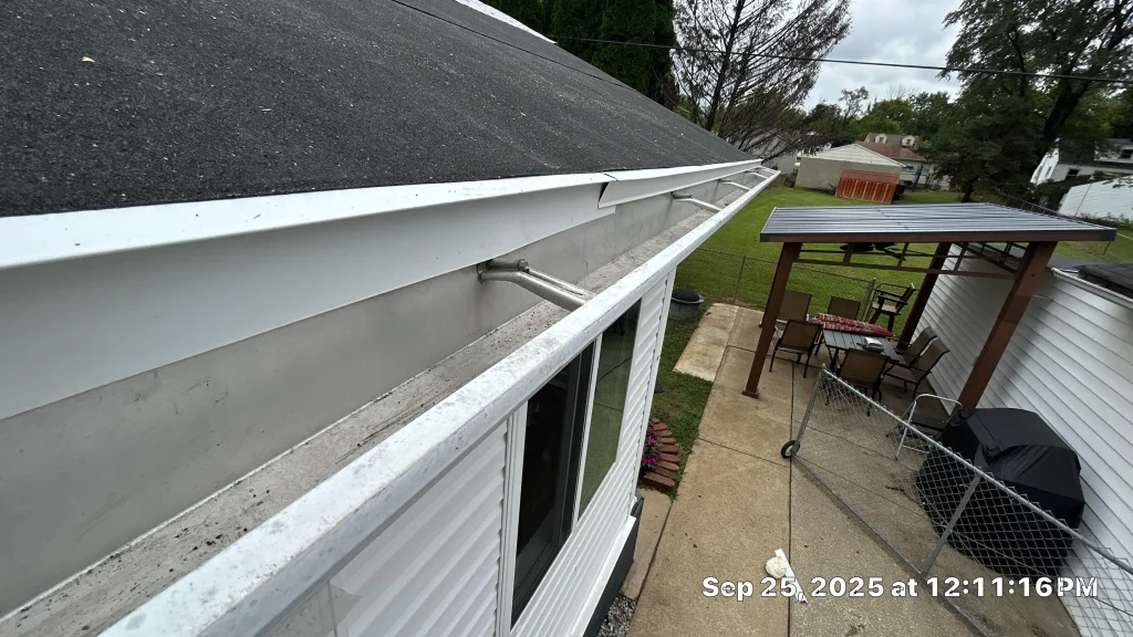 Residential gutters on a Louisville home, showing open channels ready for cleaning or gutter guard installation.