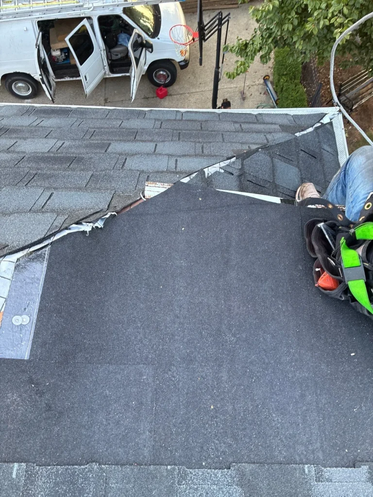 Shingle Repair in Progress on Louisville Roof Louisville roof repair in progress with shingles removed, underlayment exposed, and roofing tools visible.