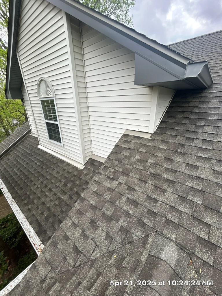New vinyl siding and dormer trim installed on a Shelbyville, Kentucky home with matching roofline and flashing.