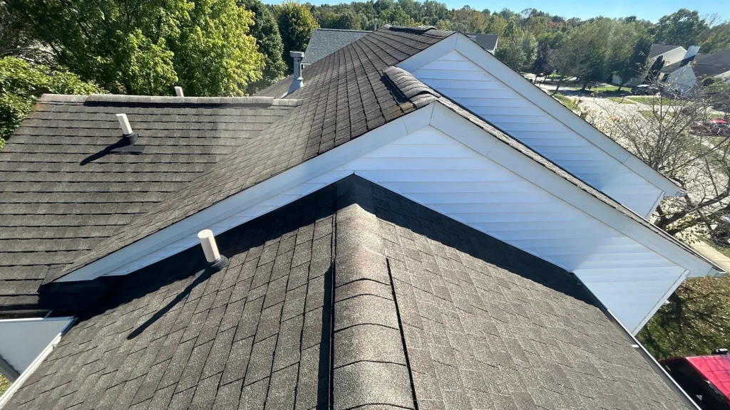 Completed asphalt shingle roof with ridge caps and vent pipes on a home in Bardstown, Kentucky.