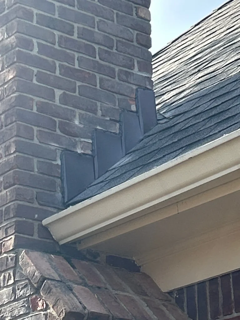 Repaired gutter along a brick home in Bardstown, Kentucky, showing proper alignment and sealing near the chimney.
