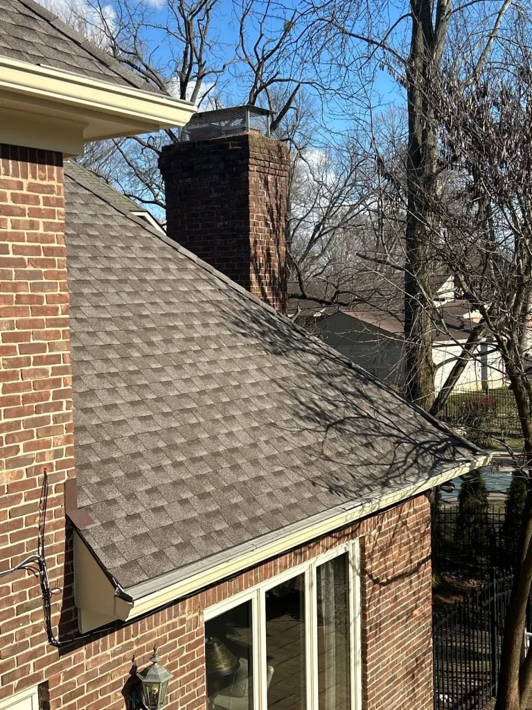 New seamless gutters installed on a brick home in Shelbyville, Kentucky, providing improved roof drainage and curb appeal.