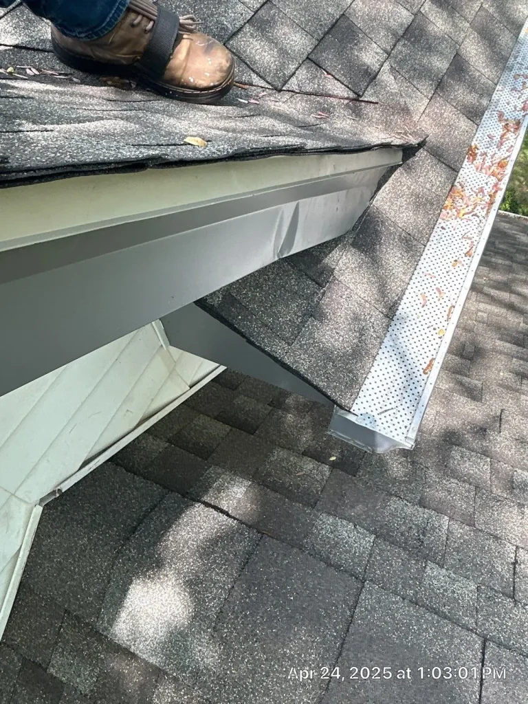 Roof repair and gutter guard installation in progress on a residential home in Bardstown, Kentucky.