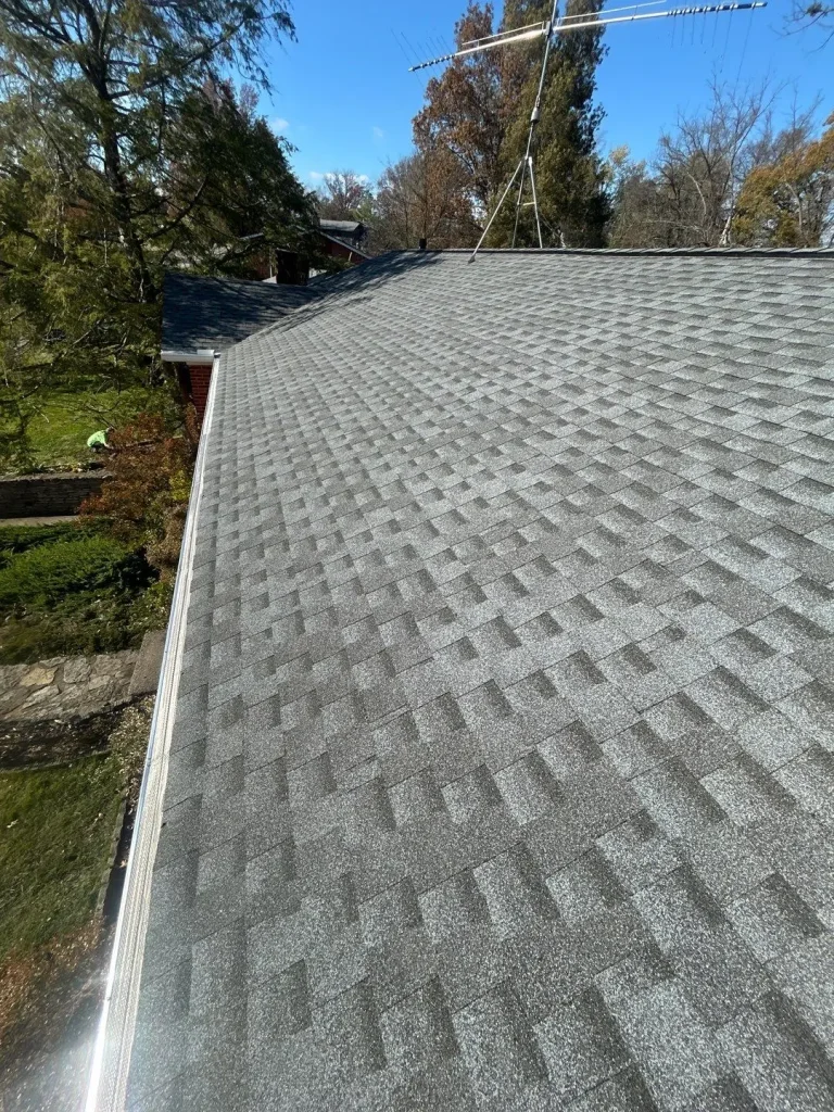 New gutter guards installed along the edge of a Kentucky home’s roof to prevent leaves and debris from clogging the gutters.