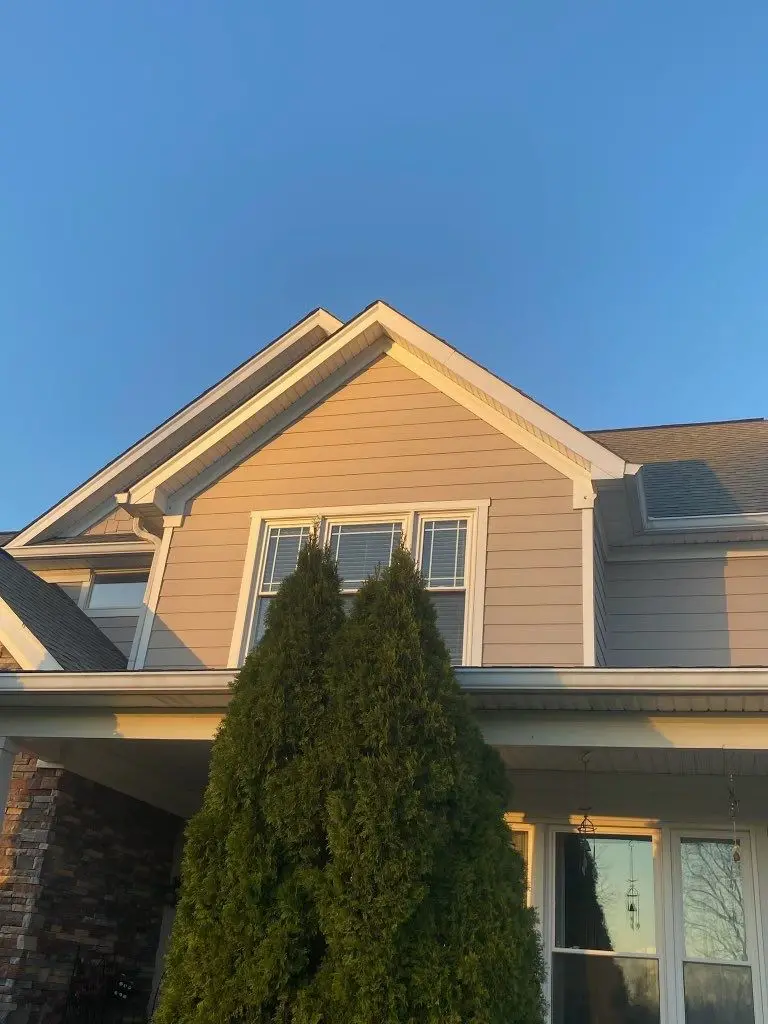Newly repaired roof on a La Grange, KY home glowing in the sunset.