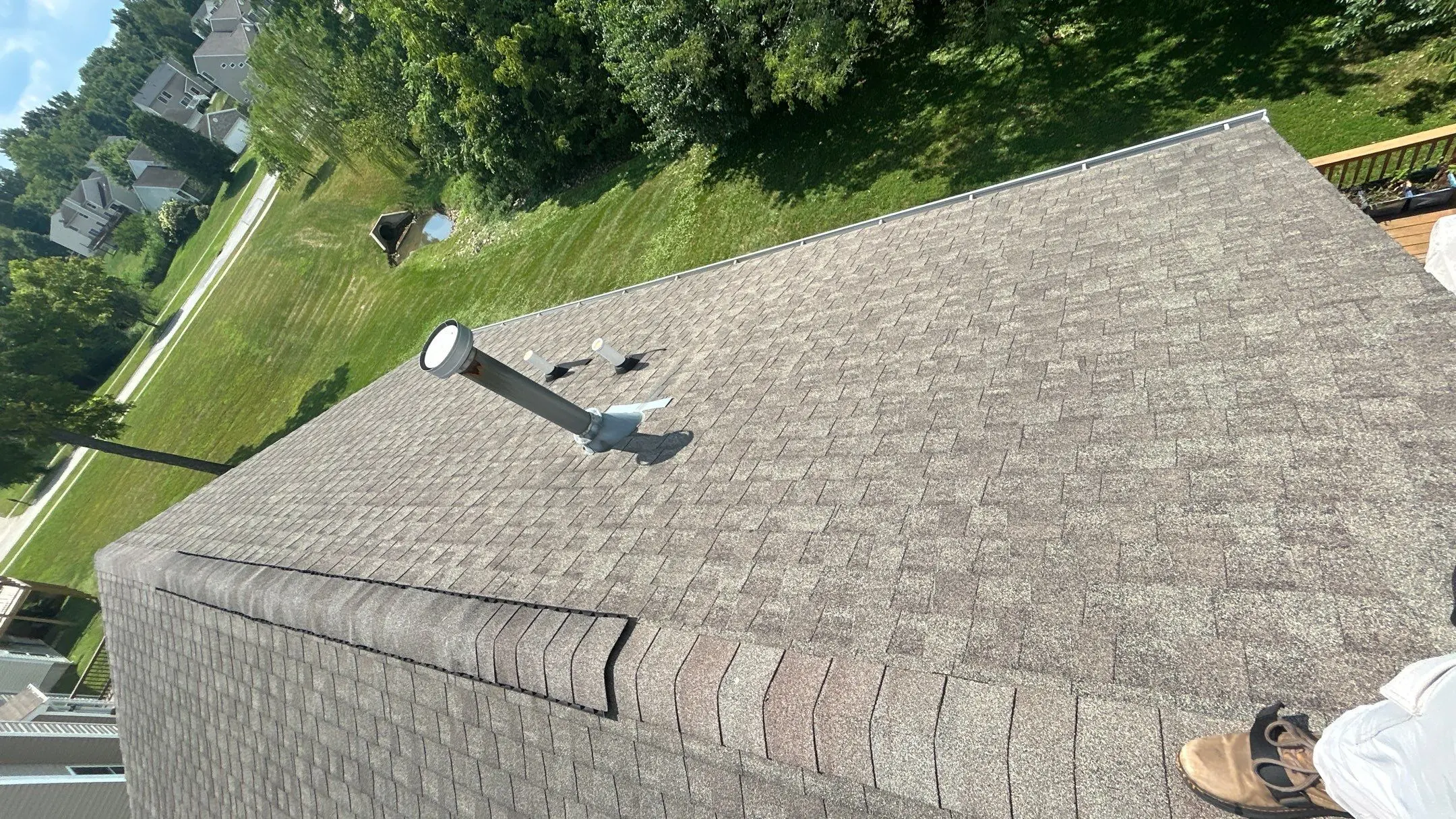 Roof penetration with deteriorating flashing on an asphalt shingle roof in La Grange, KY.