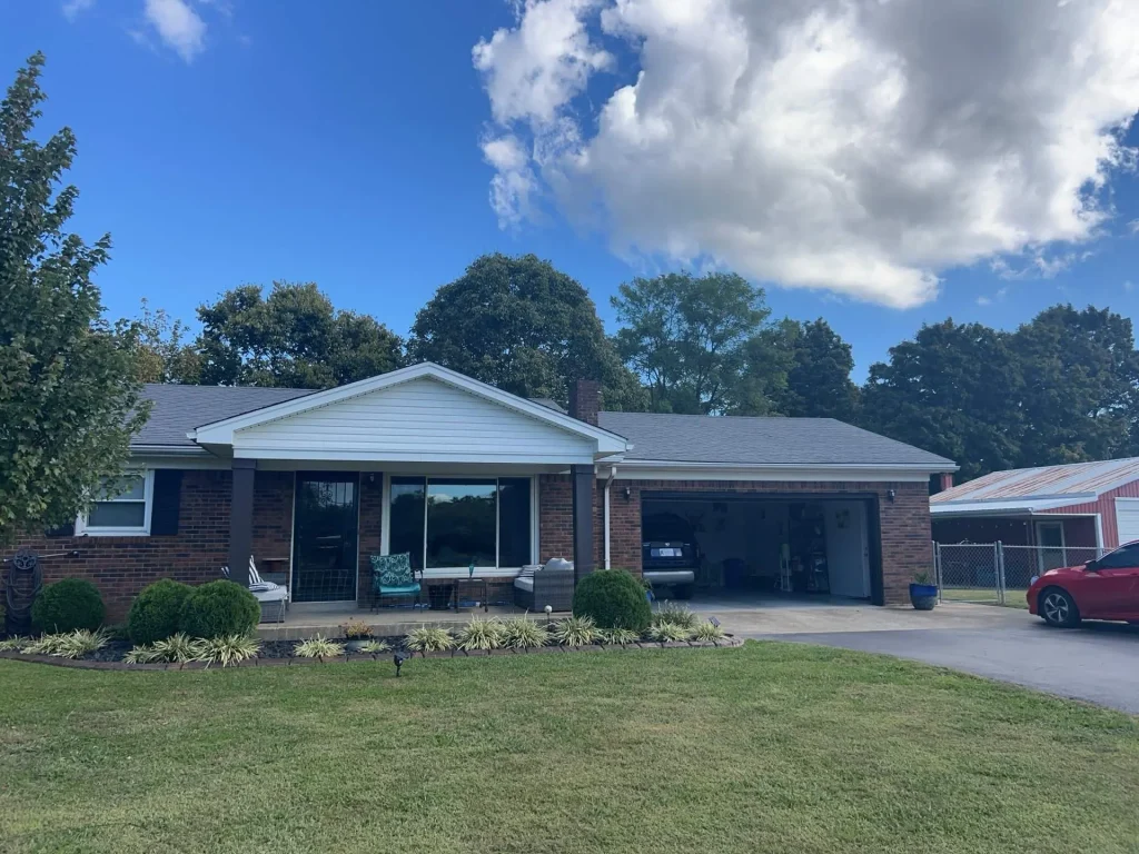 Brick ranch home with a newly installed asphalt shingle roof after a full roof replacement in Shepherdsville KY.