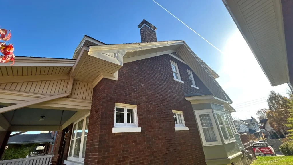 Newly installed gutters on a brick home in Louisville KY designed to improve drainage and protect the roofline