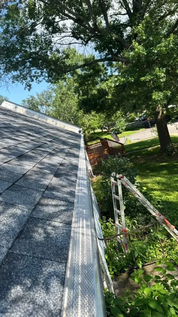 Gutter guards installed along roof edge on a Louisville, Kentucky home to prevent debris buildup