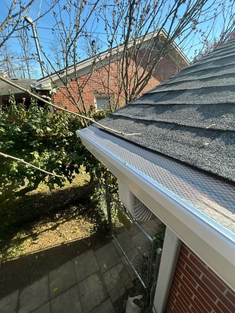 Newly installed gutter guards on a residential home in Louisville, Kentucky preventing leaves and debris buildup
