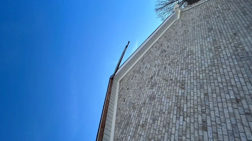 Missing gutter downspout on a Louisville KY home causing improper roof drainage and potential water damage