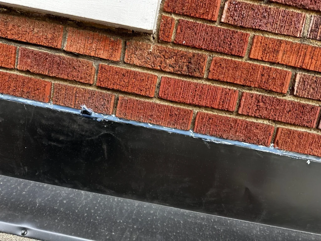 Newly installed chimney flashing on a residential roof in Louisville, Kentucky