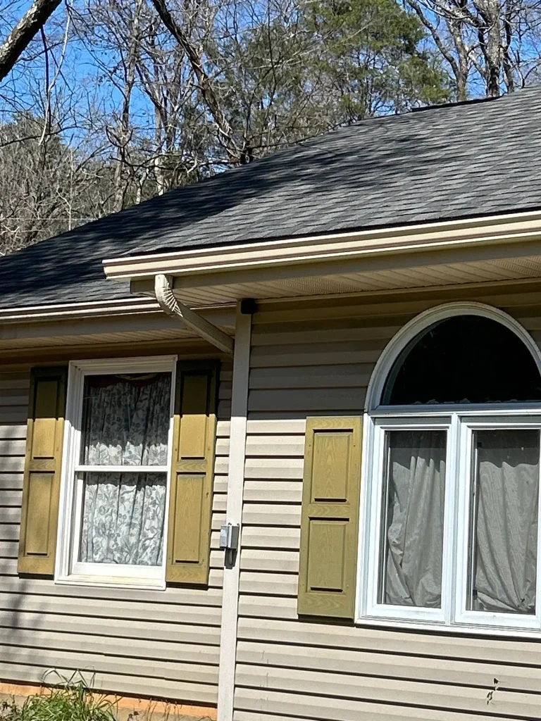 Residential roof and gutter system on a Louisville KY home designed to protect siding and foundation from water damage
