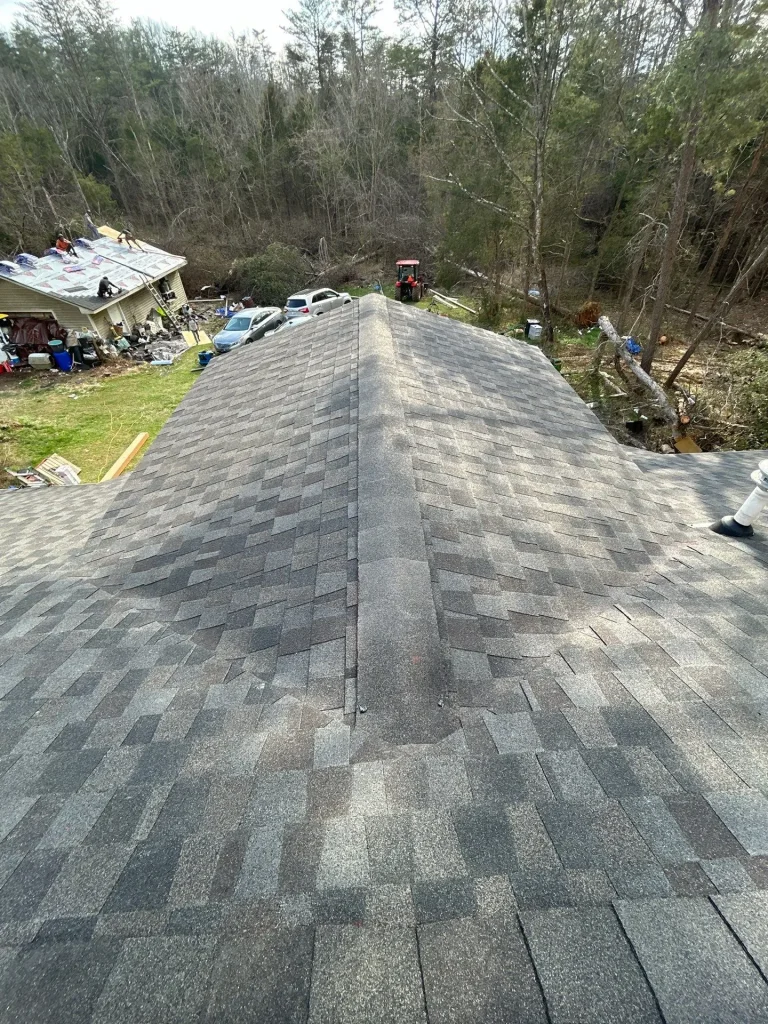 Roof repair in Louisville KY showing repaired asphalt shingle ridge