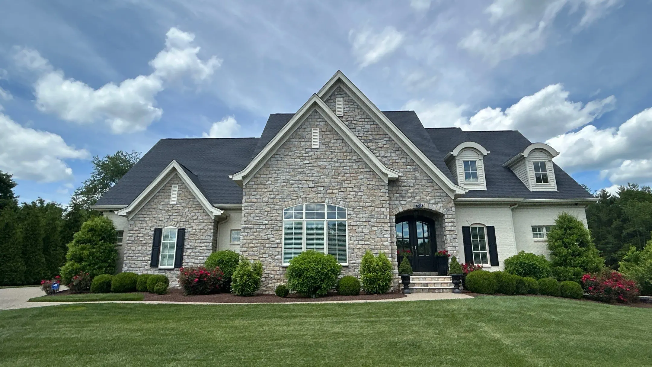 Roof replacement completed on a large residential home in Peewee Valley, Kentucky with new asphalt shingles