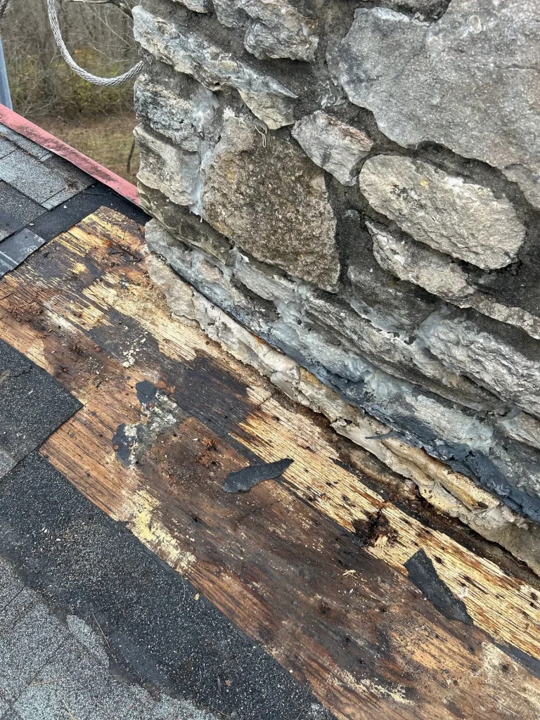 Rotted roof decking caused by chimney leak and failed flashing on a Nicholasville KY home