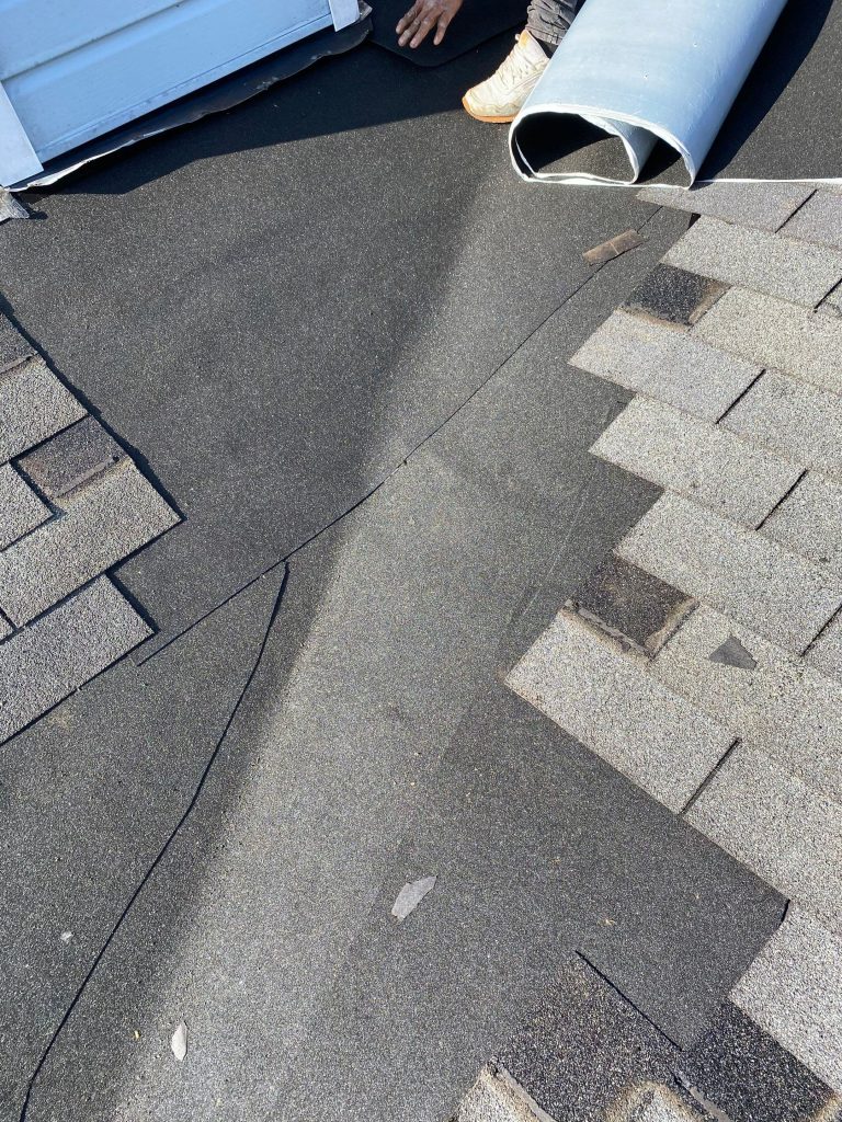 Exposed roof underlayment and removed shingles during roof repair on a Louisville KY home