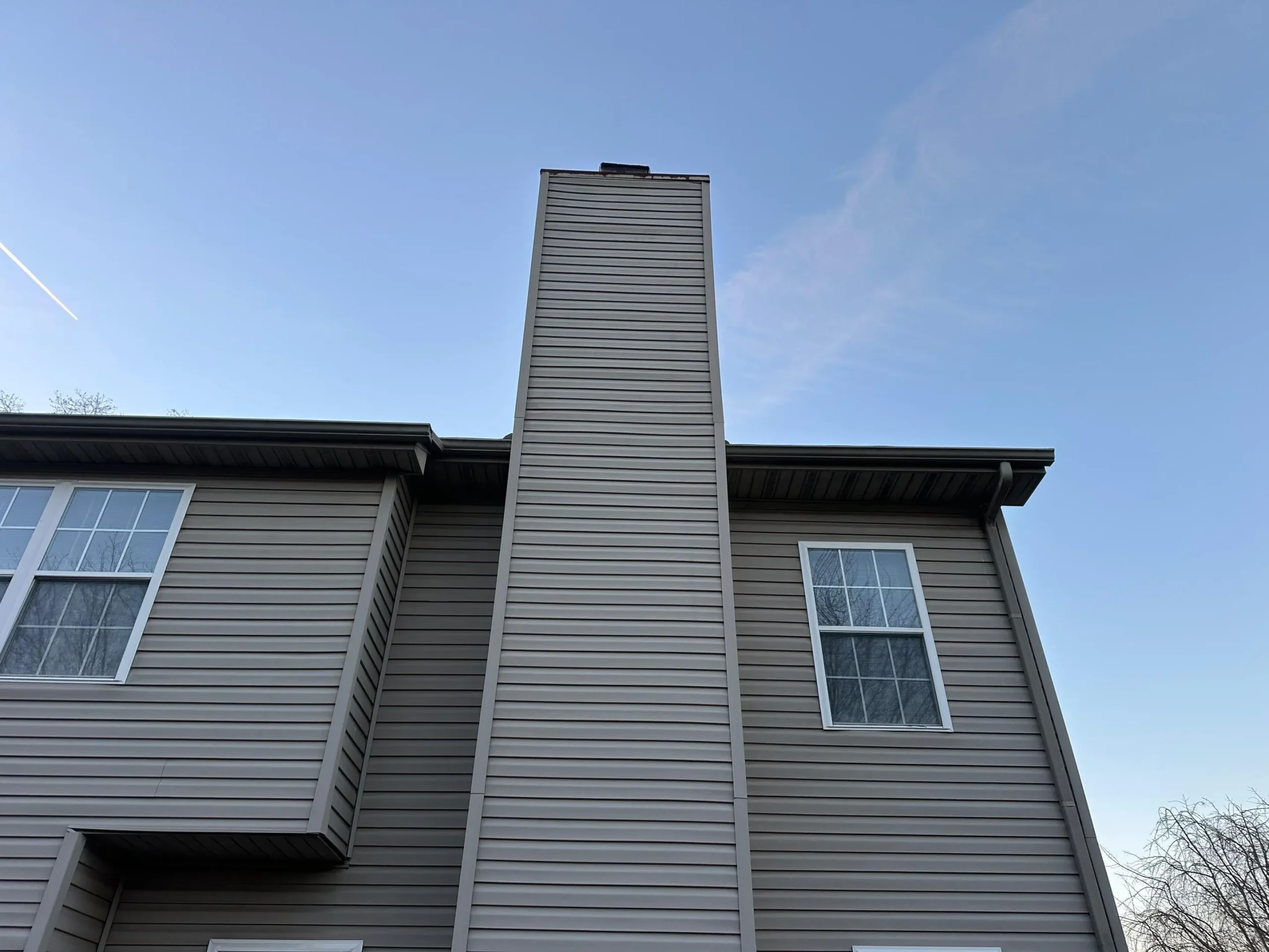 Vinyl siding chimney chase on a residential home in Nicholasville, Kentucky