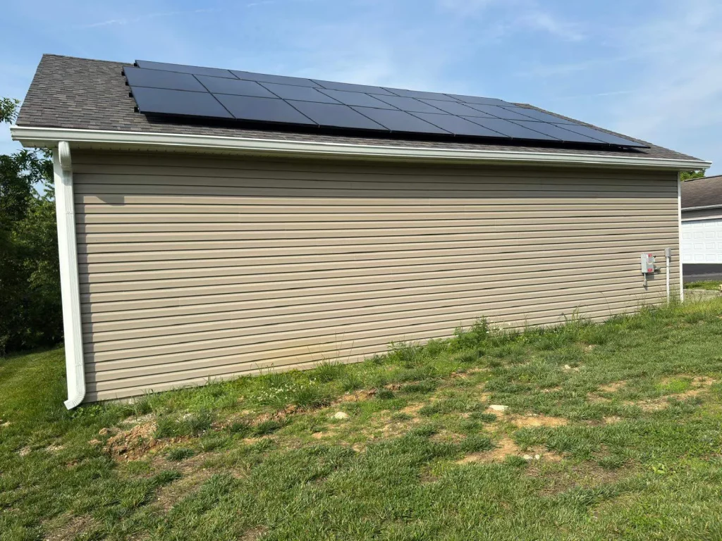 New gutter installation on a shed in Taylorsville KY with clean aluminum gutters and downspouts