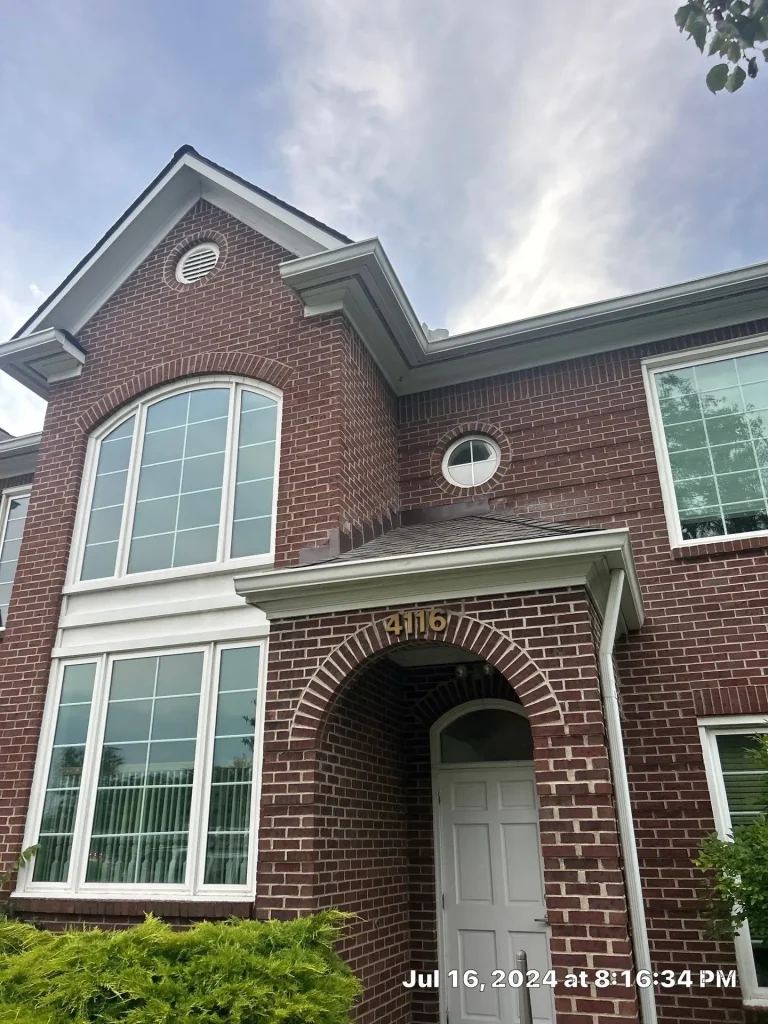 Gutters installed on a two-story brick home in Louisville, KY