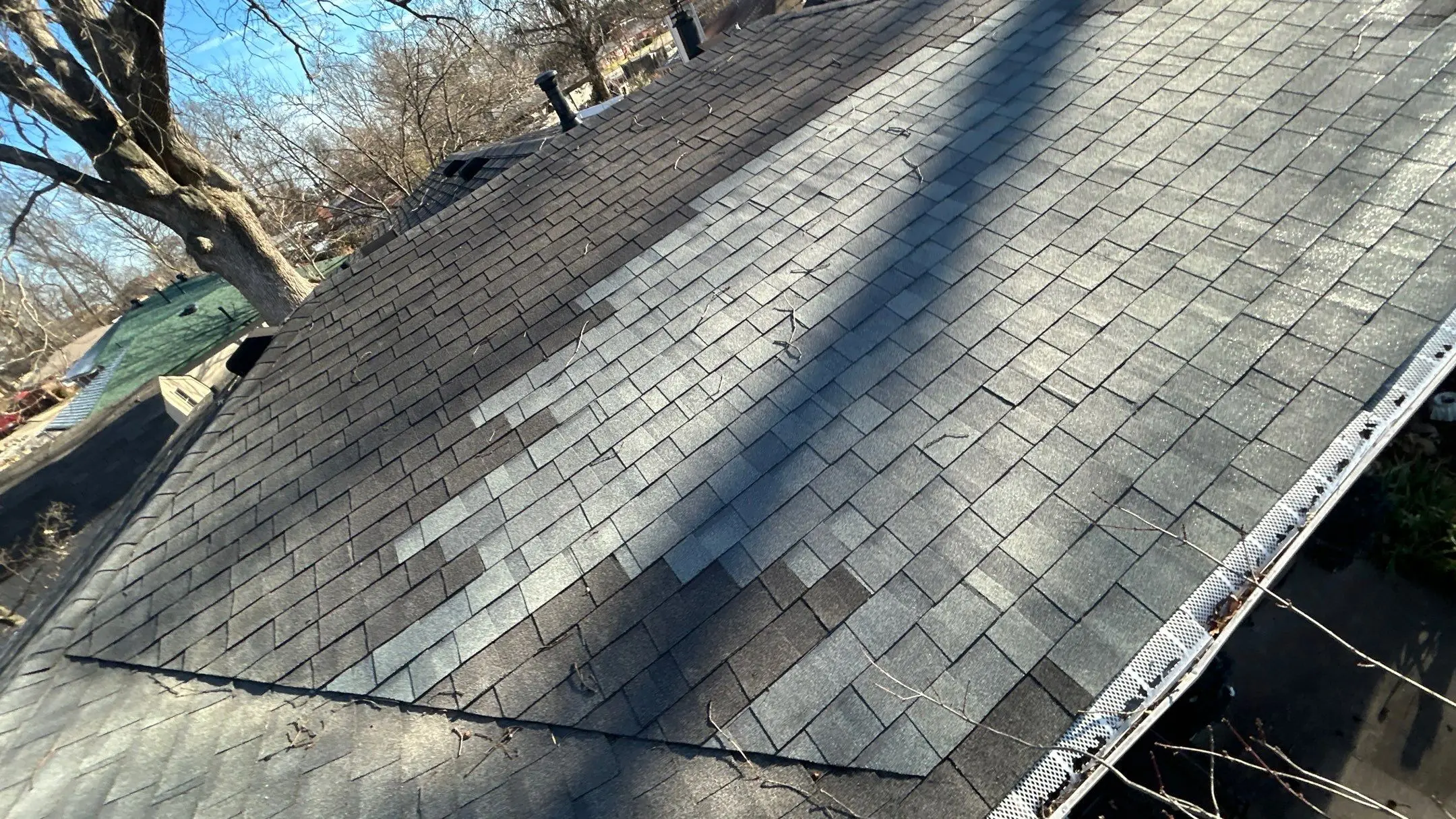 Roof shingles with visible color mismatch needing replacement in Louisville, KY