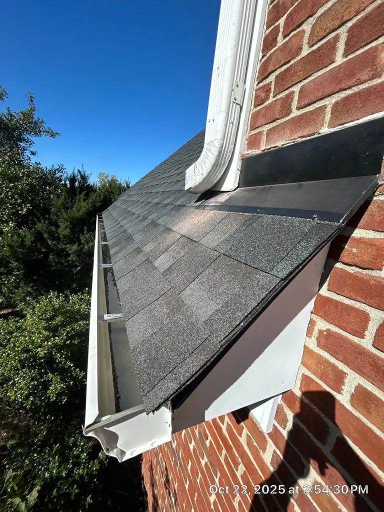 New gutter installation along the roofline of a brick home in Nicholasville, KY