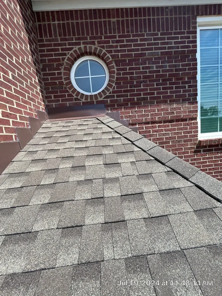 Roof-to-wall flashing detail on asphalt shingle roof in Louisville, KY