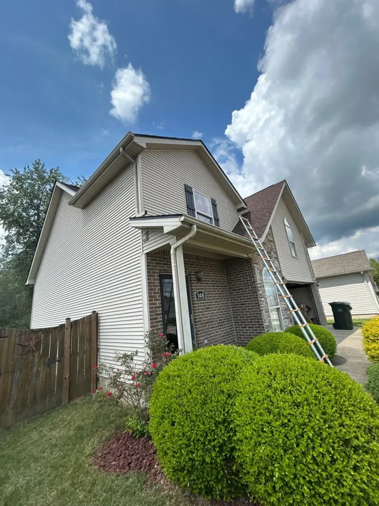 Residential home with visible gutter system along roofline for proper rainwater drainage.